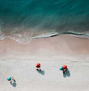 Aerial of waves coming onto a beach shore