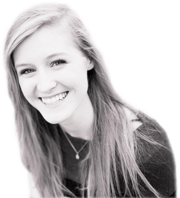A smiling Abby in black and white